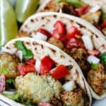 cauliflower tacos topped with pico de gallo
