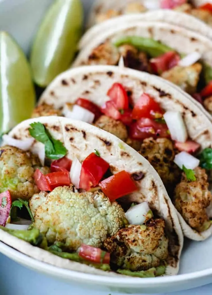 cauliflower tacos topped with pico de gallo,#9 on our best vegan taco list