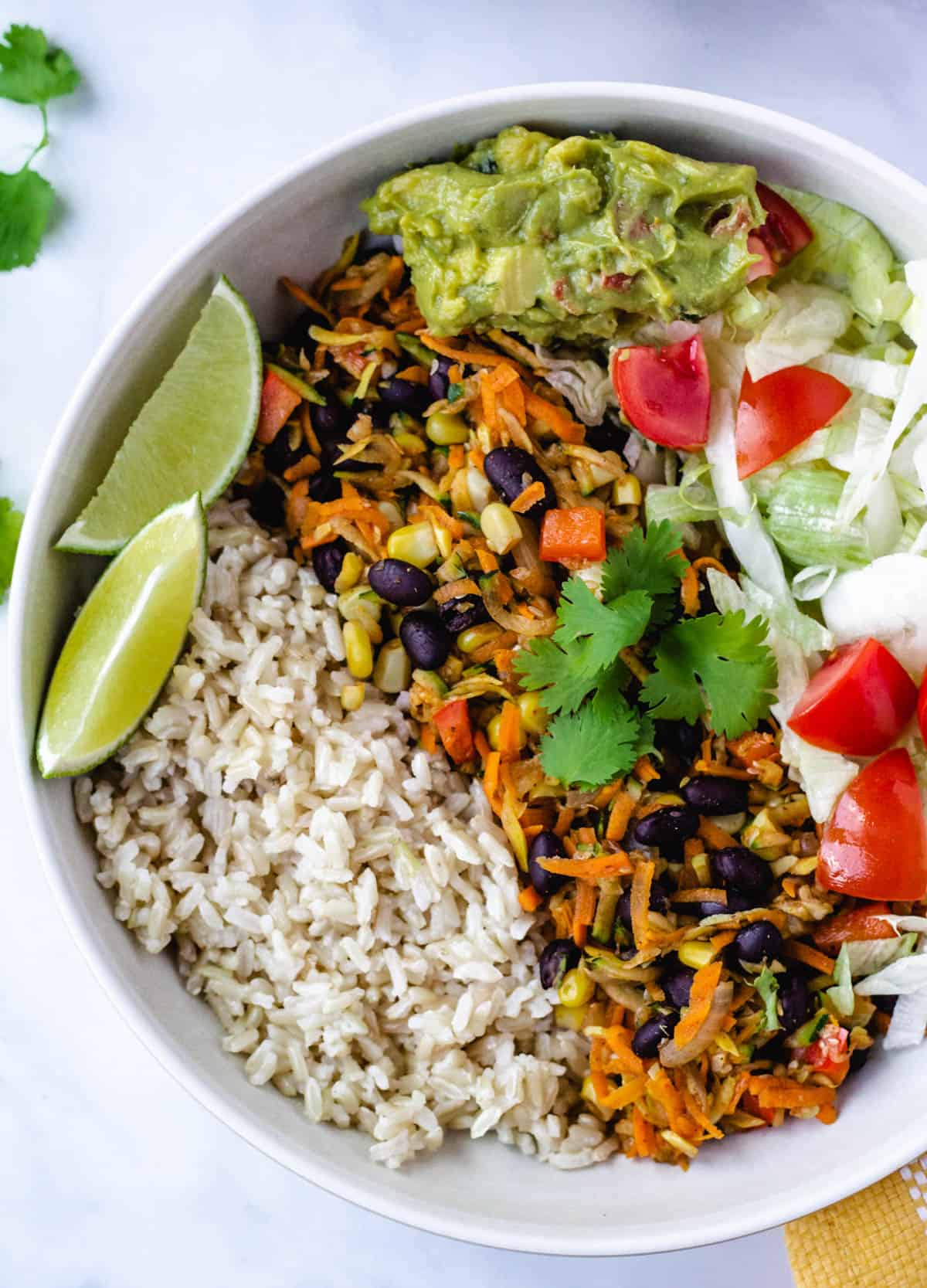vegan burrito bowl with wedge of lime