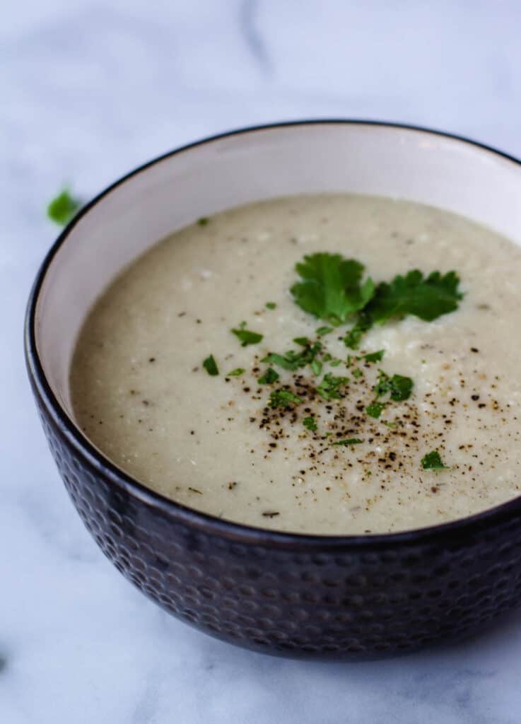 cauliflower soup in gray bowl
