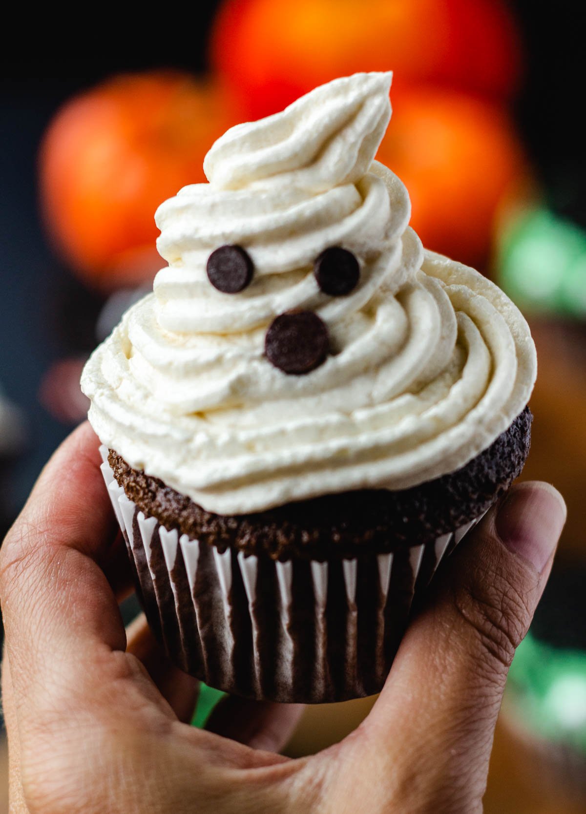 hand holding ghost cupcake