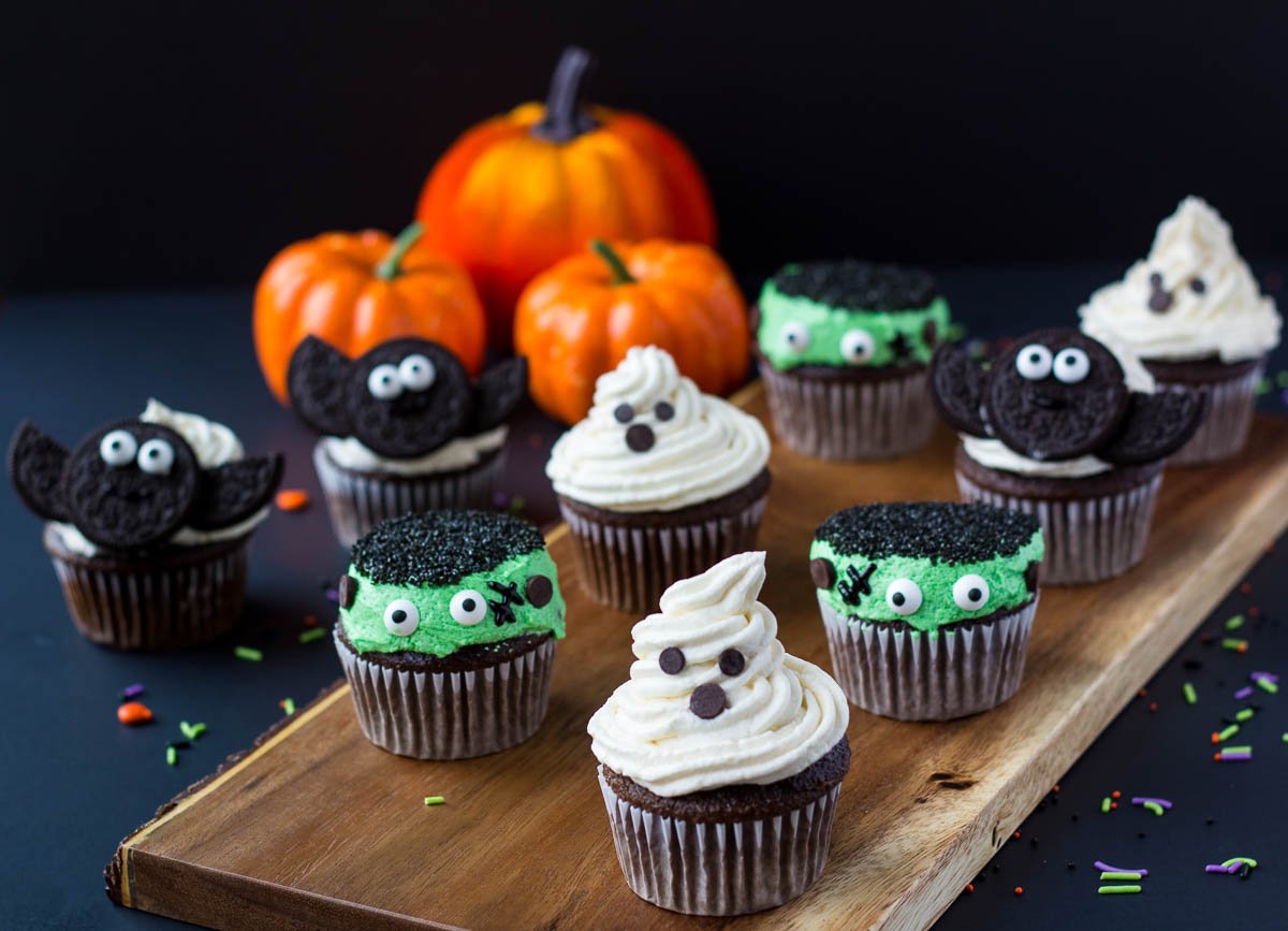 halloween cupcakes, a ghost, monster, and bat