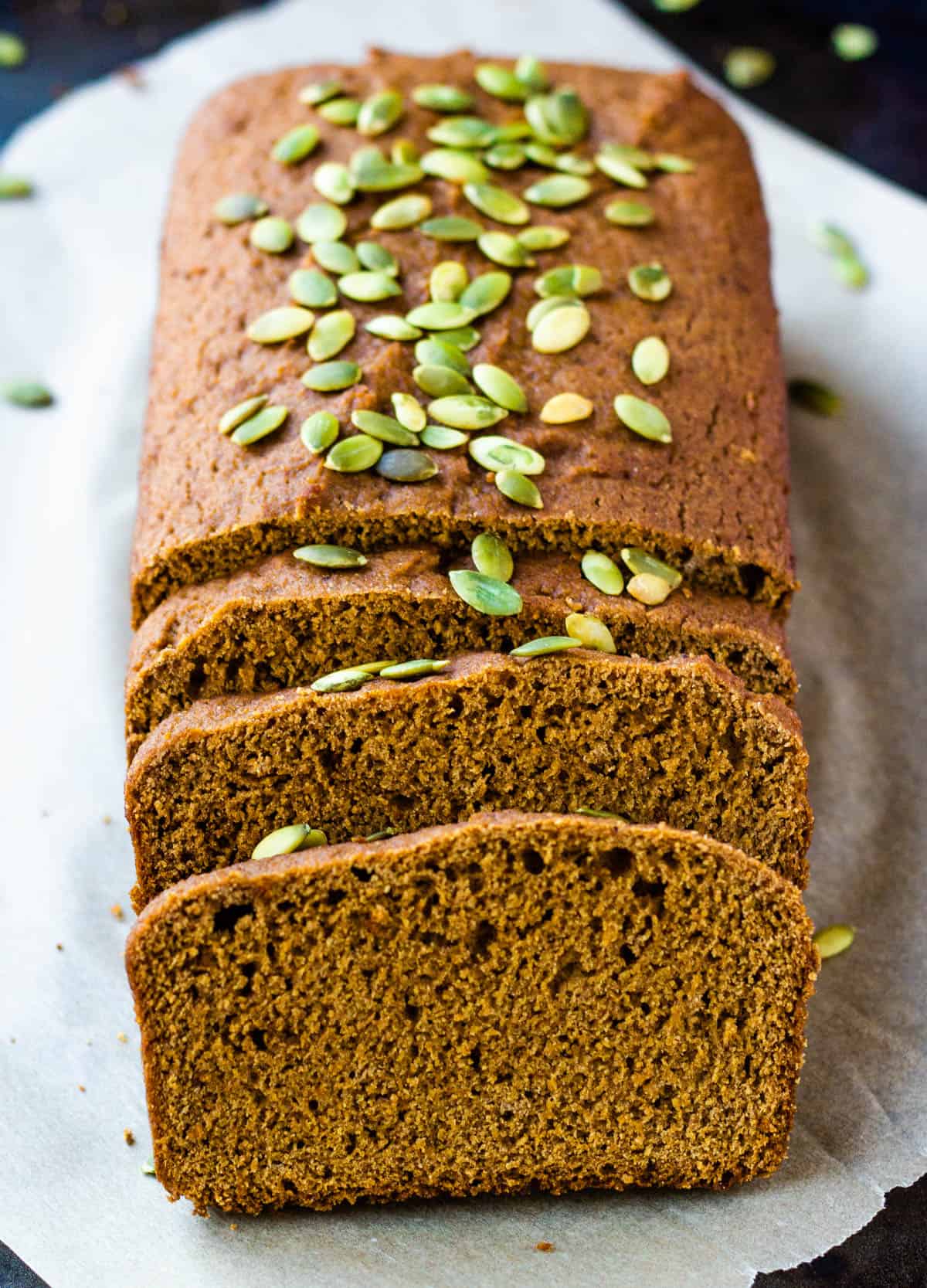 Vegan pumpkin banana bread loaf with slices cut. 