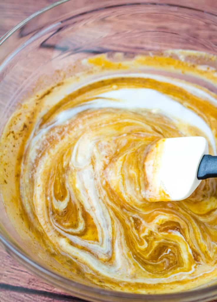 bowl of coconut cream and pumpkin puree swirled together