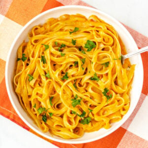 vegan pumpkin pasta in white bowl