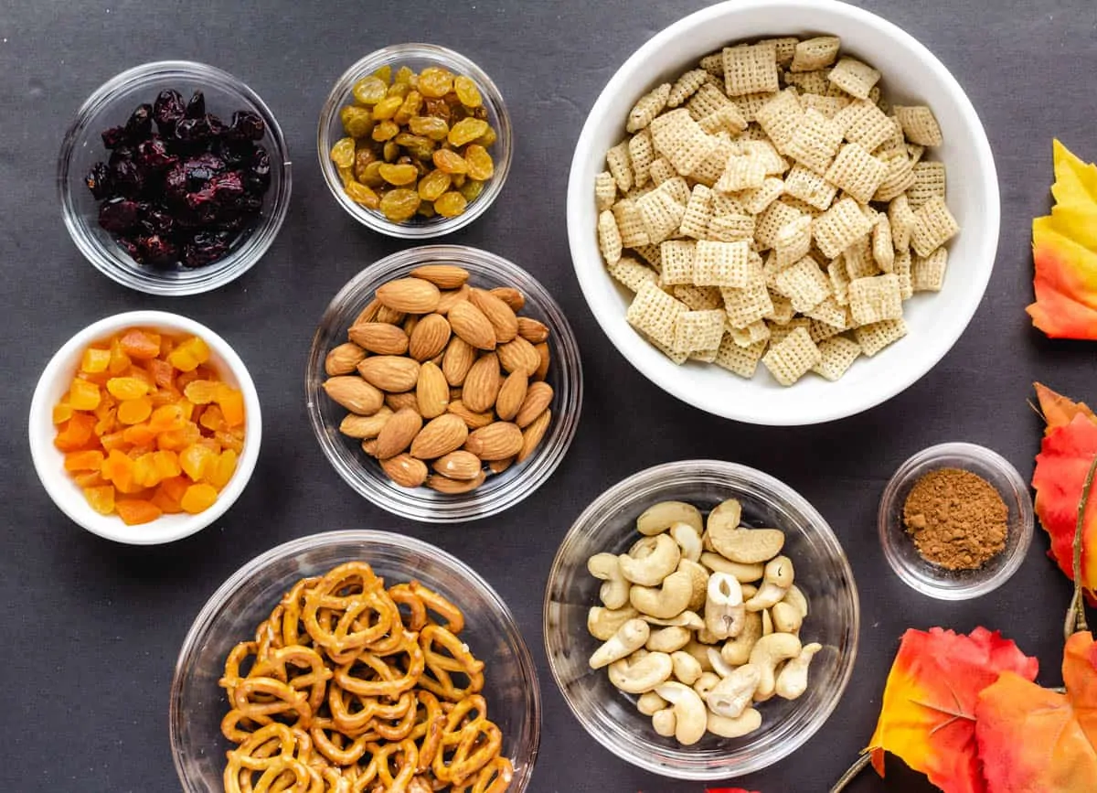 ingredients for vegan trail mix in small bowls