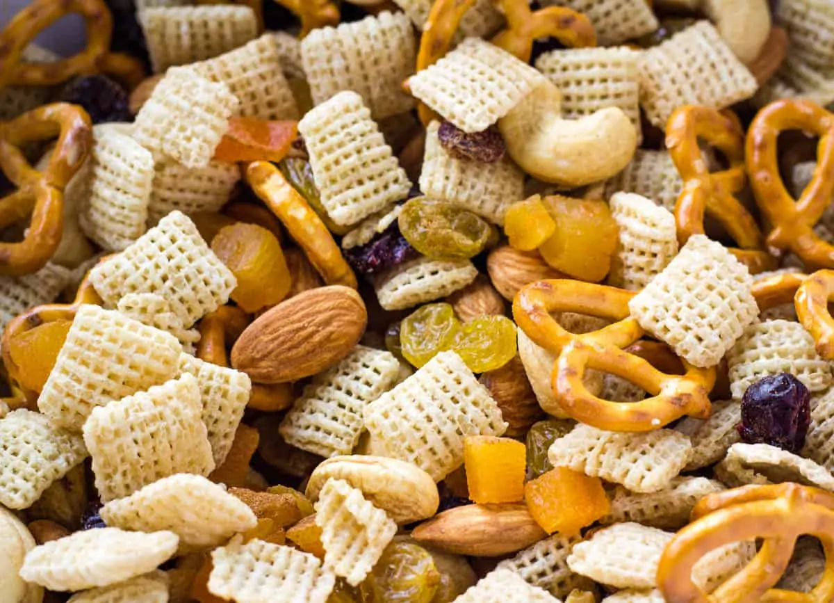 close up of snack mix with pretzels and chex