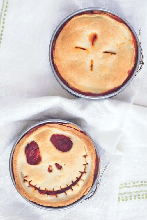 Pizza pot pies with skeleton face.