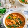 bean and vegetable soup in white bowl
