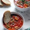 vegan minestrone soup with slice of bread