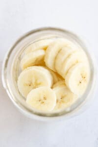 Sliced banana in mason jar.