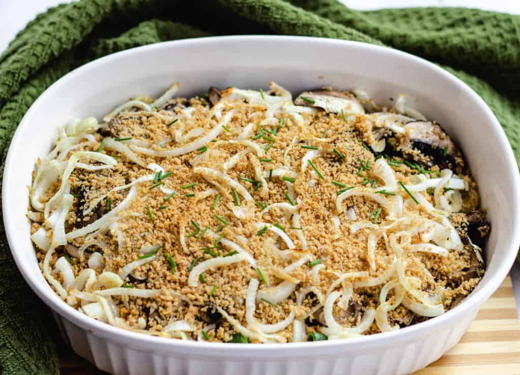 dairy free green bean casserole surrounded by green kitchen towel