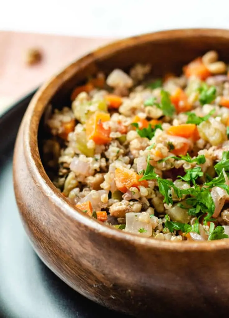 quinoa with vegetables in wood bowl
