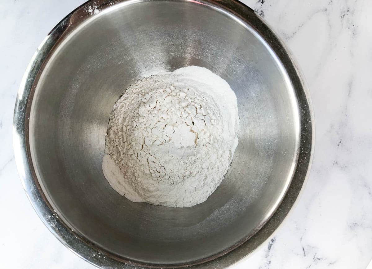 Flour and baking powder in a mixing bowl.
