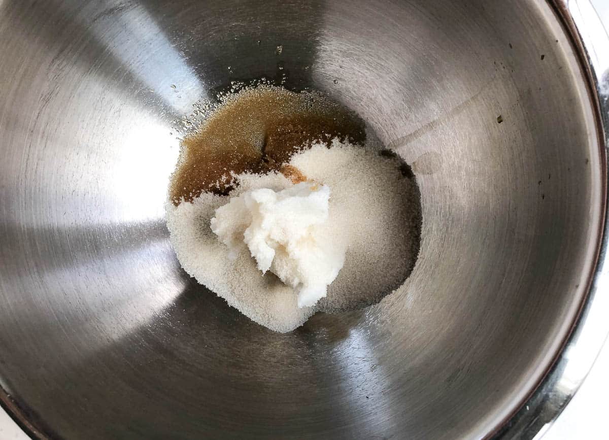 Coconut oil, sugar, and vanilla in mixing bowl.
