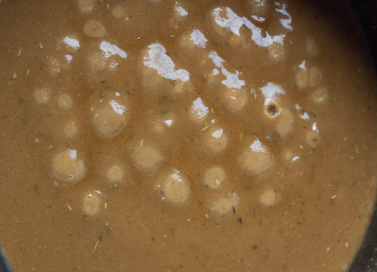 vegan gravy bubbling and boiling in pot