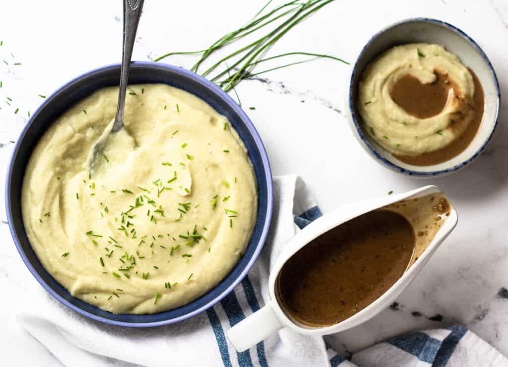 mashed potatoes and gravy in gravy boat