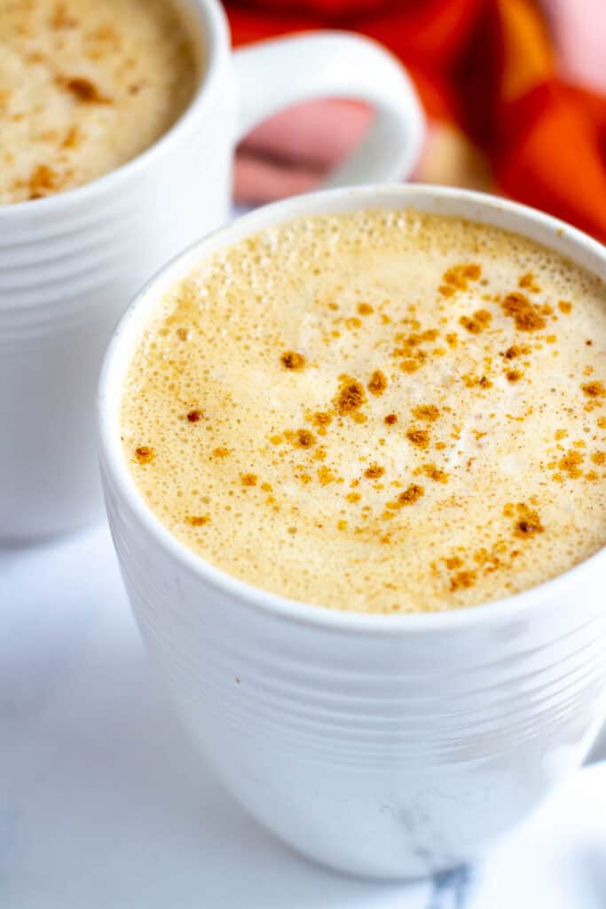 vegan pumpkin spice latte in white mug