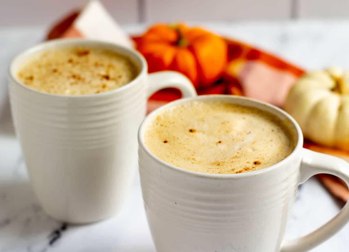 Two cups of pumpkin lattes.