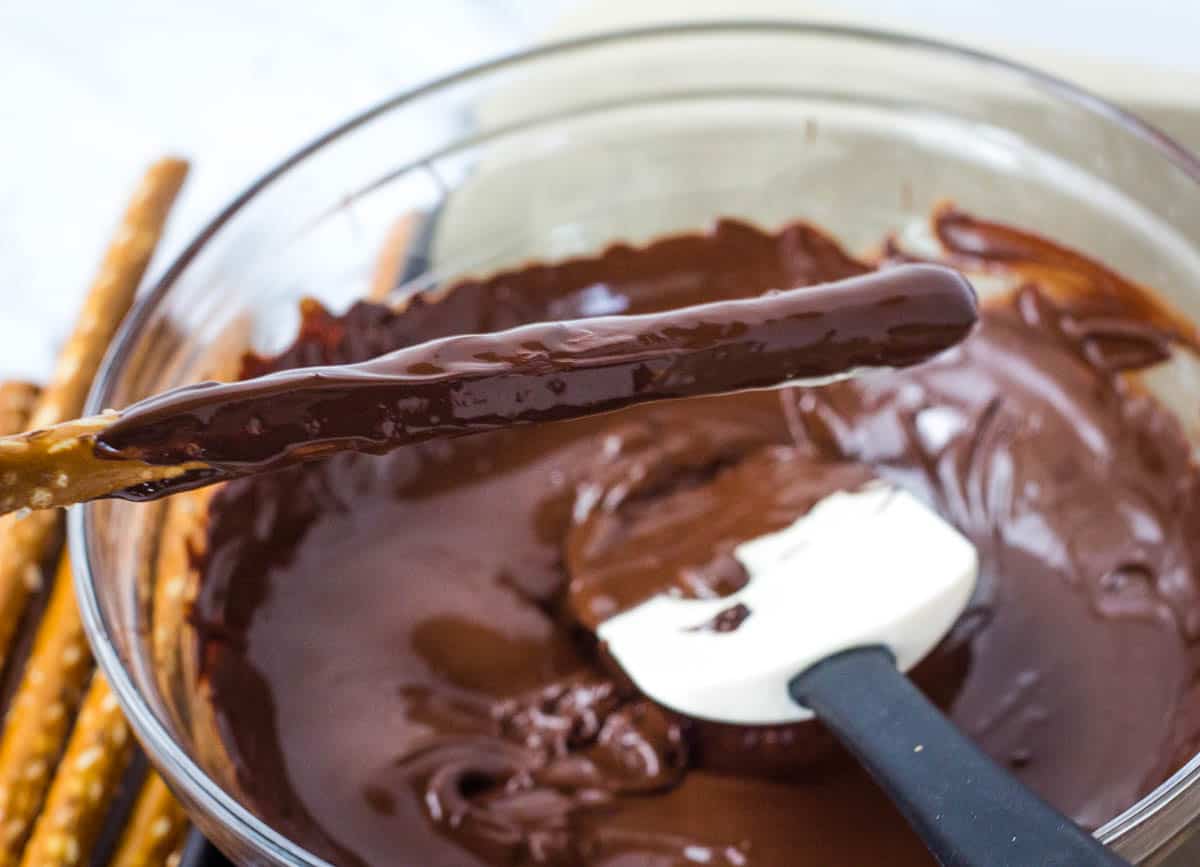 pretzel rod dipped in melted chocolate
