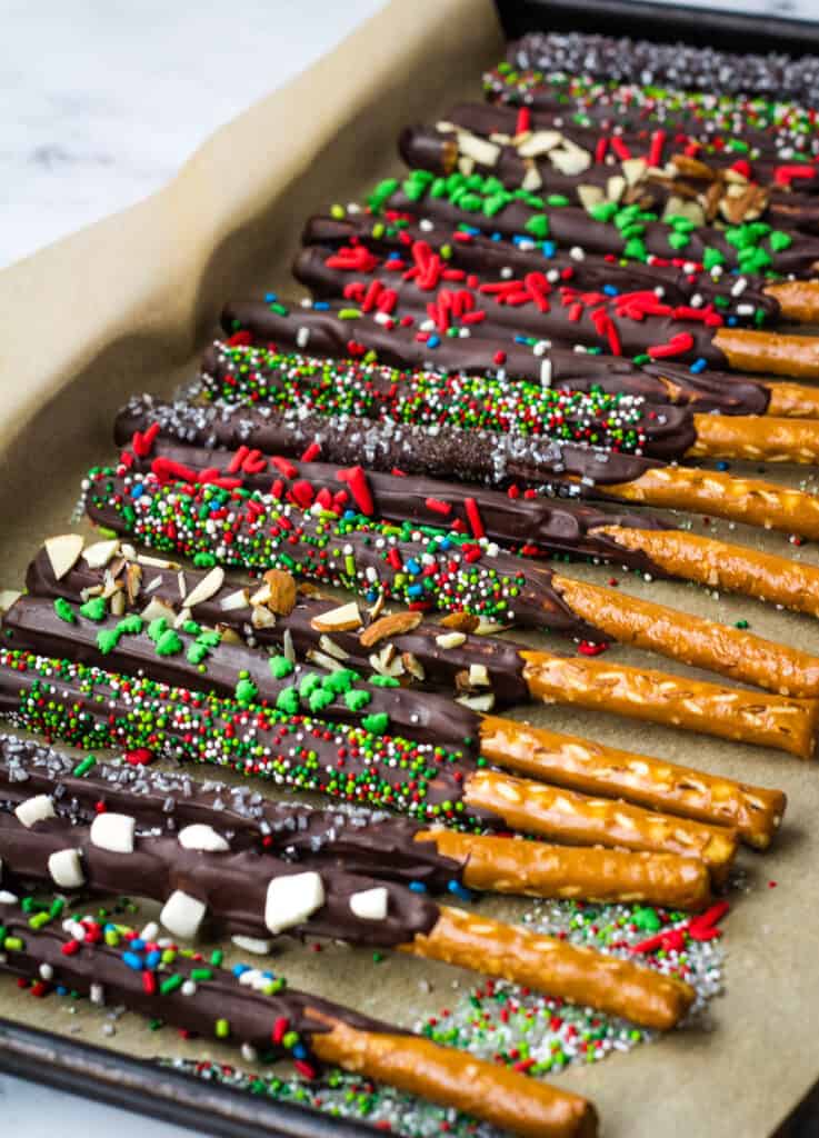 set chocolate pretzel rods on baking sheet