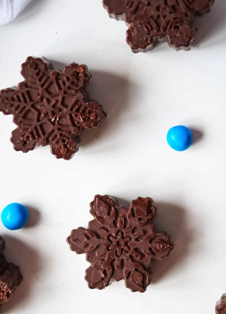 dark chocolate snowflakes surrounded by blue candy balls