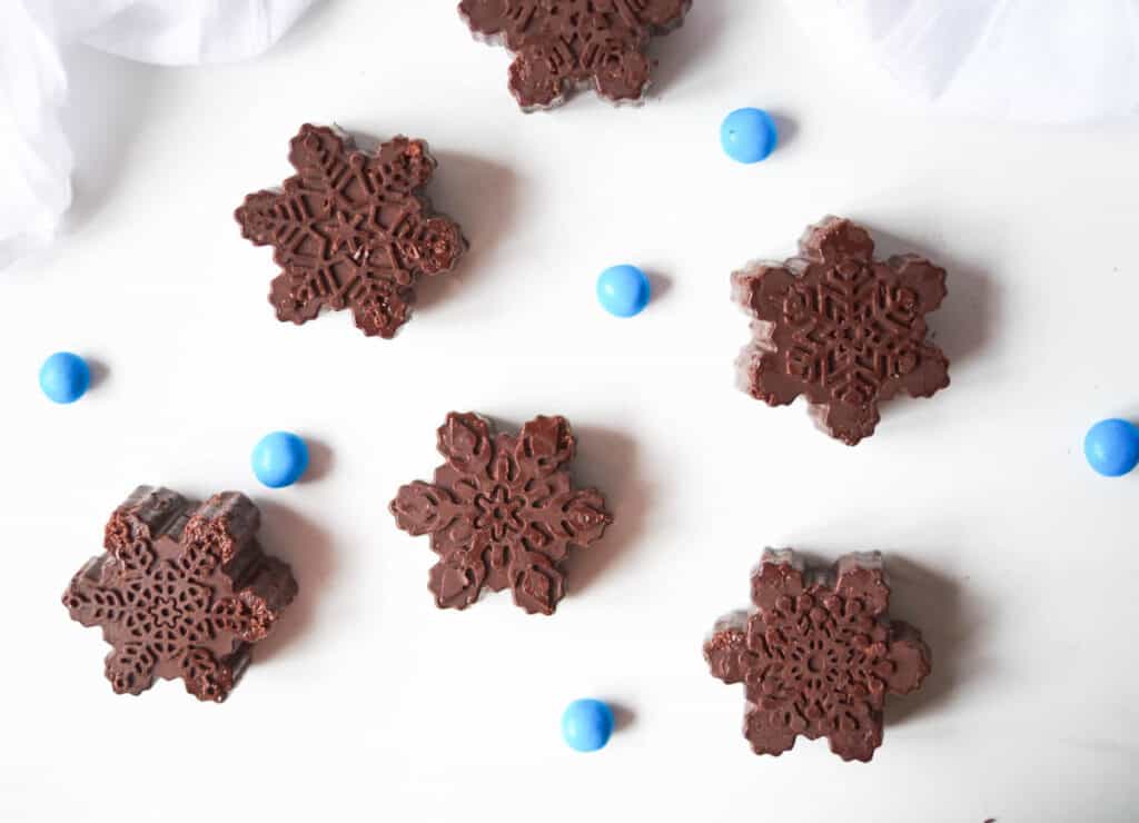 dark chocolate snowflakes surrounded my blue candy balls
