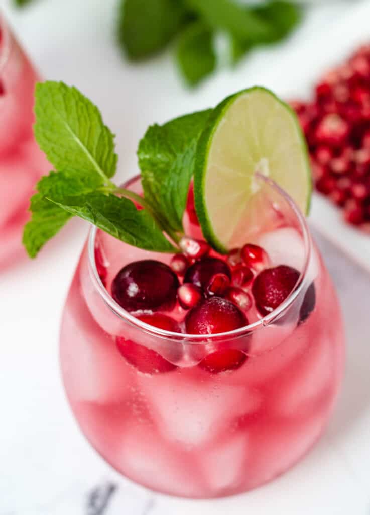 cranberry mocktail in stemless wine glass