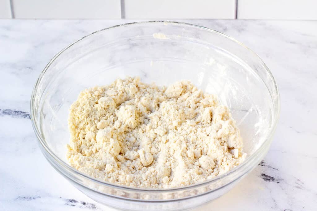 crumbly flour mixture in glass bowl