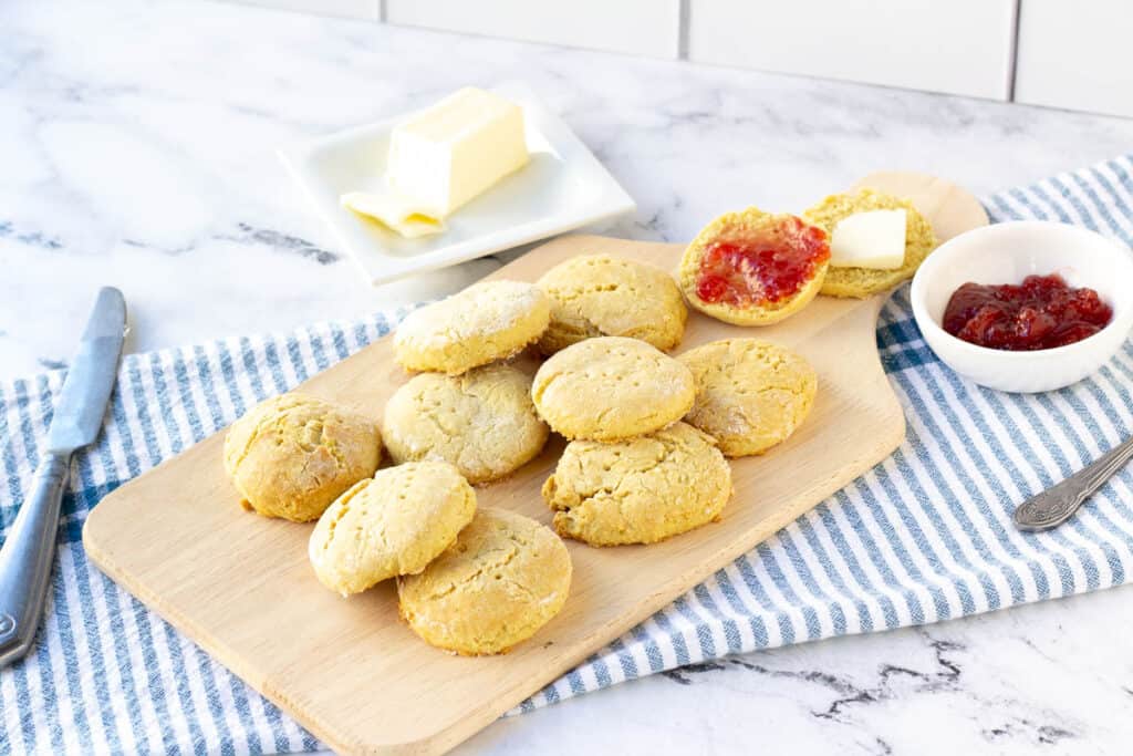 dairy-free biscuits on wood serving tray with jam and butter