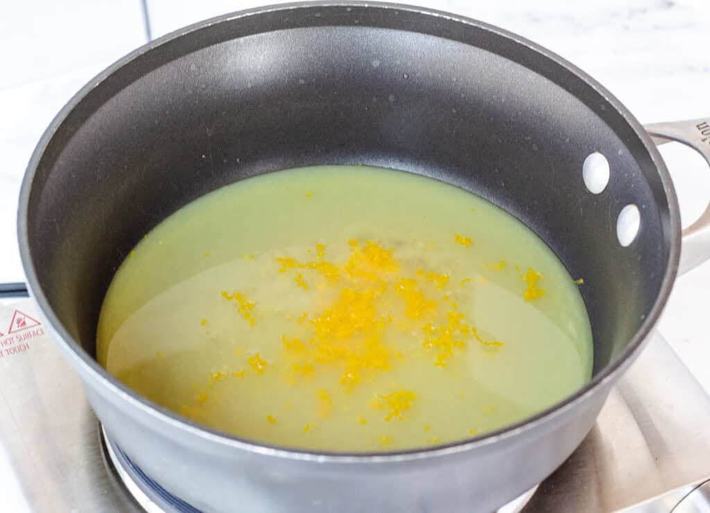 orange juice and zest in pot