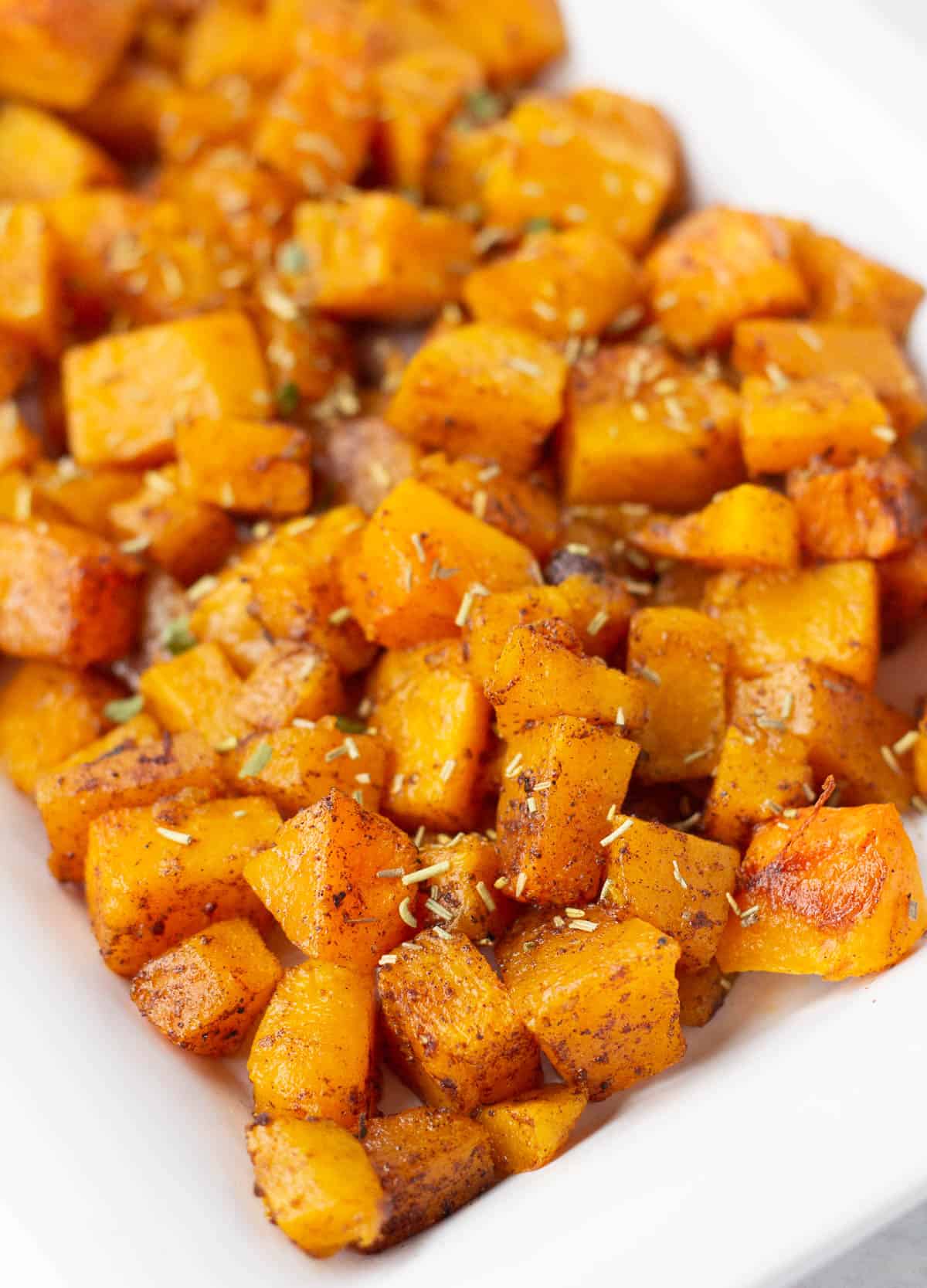 cinnamon butternut squash topped with herbs