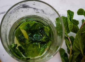 mint muddled in glass