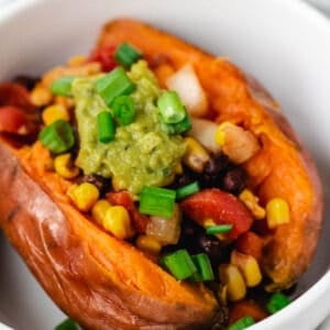 vegan loaded sweet potatoes with black beans and corn