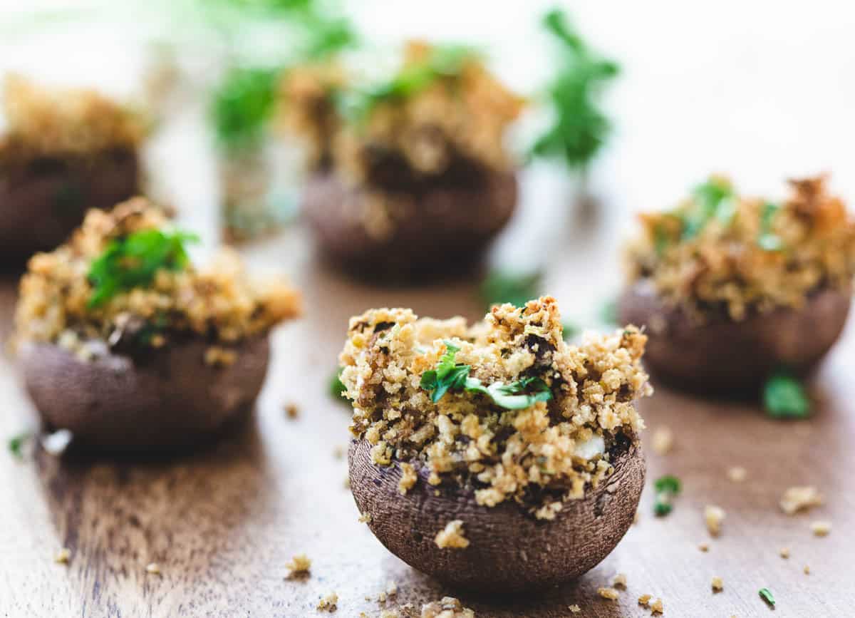 vegan stuffed mushrooms on wood serving platter