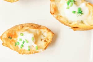 potato skins topped with sour cream and chives