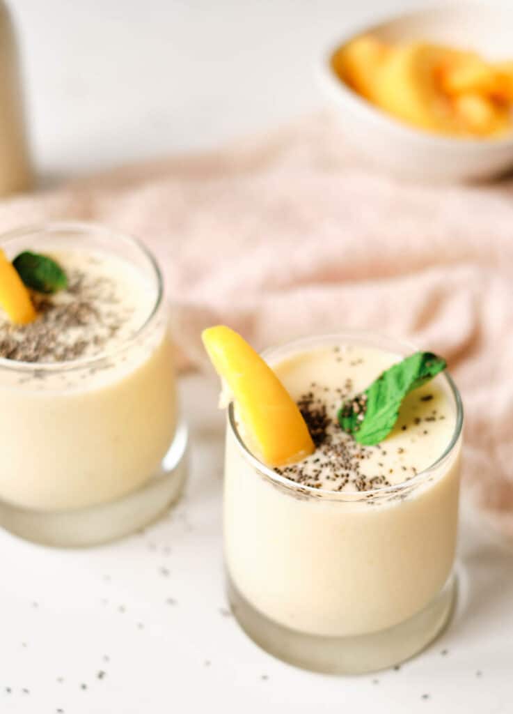 peach smoothies topped with chia seeds and mint
