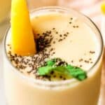 banana peach smoothie garnished with chia and mint