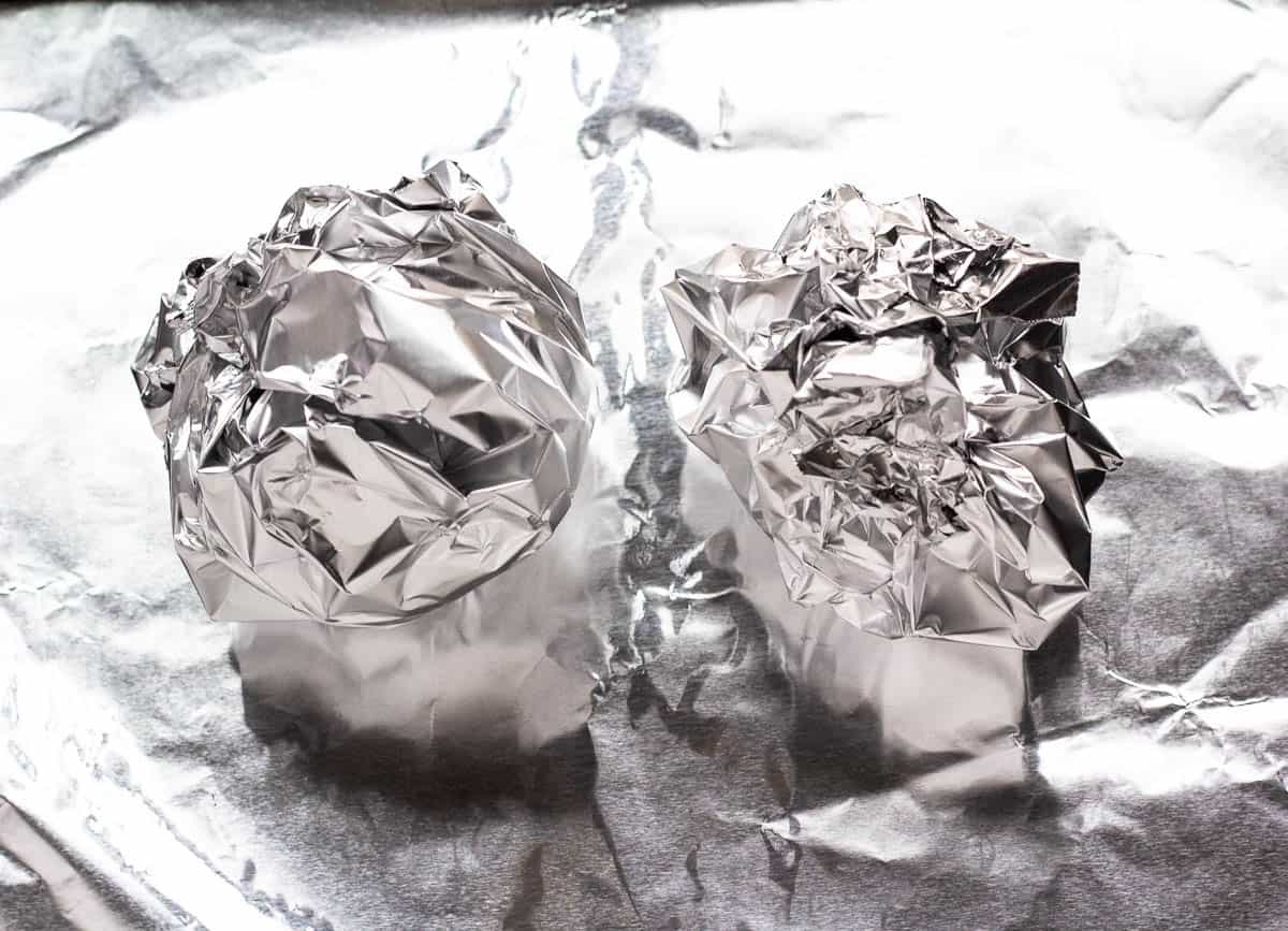2 beetroot bulbs wrapped in aluminum foil