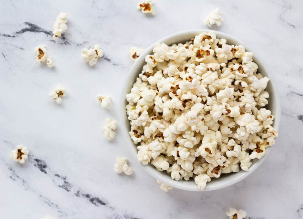 salted vegan popcorn in white bowl