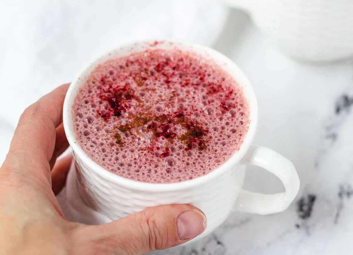 Beet latte topped with cinnamon.