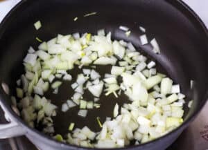 chopped onions in black sauté pan