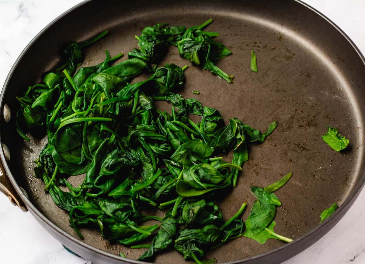 Sautéd spinach in pan.
