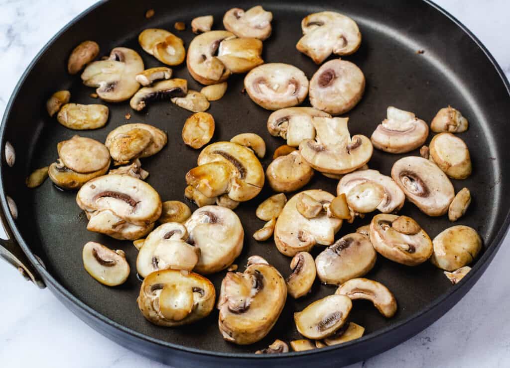 sautéd mushrooms slices in pan