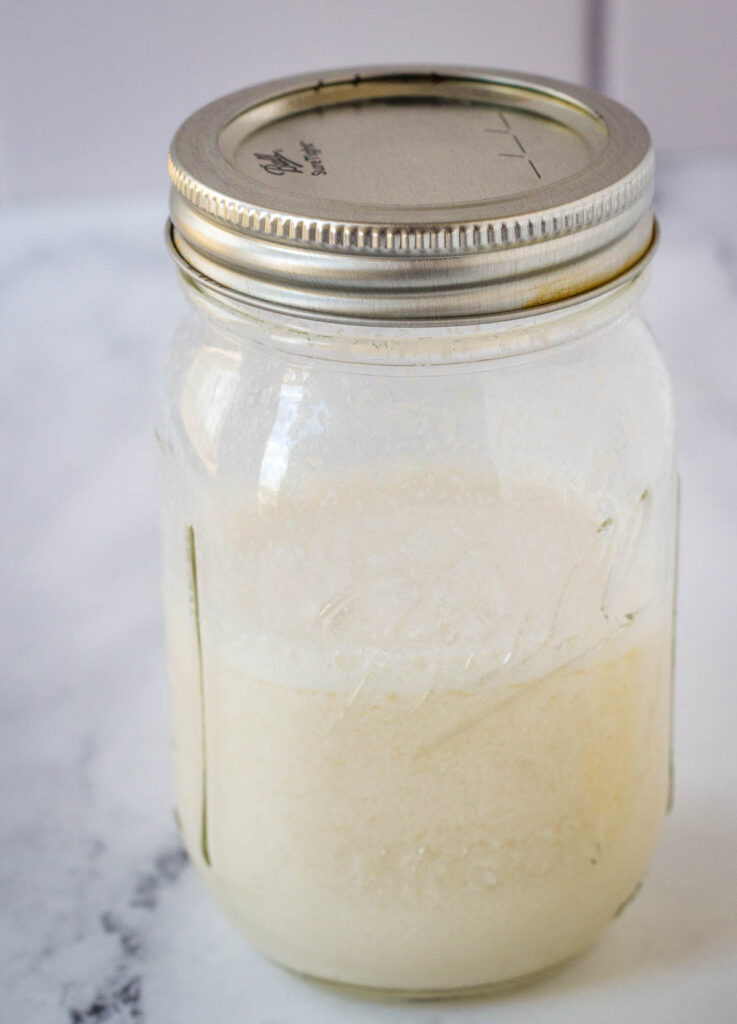 vegan buttermilk in mason jar on marble countertop