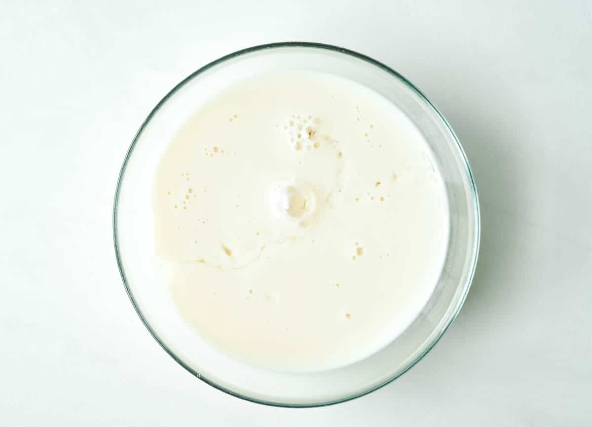 soy milk and vinegar in small glass bowl