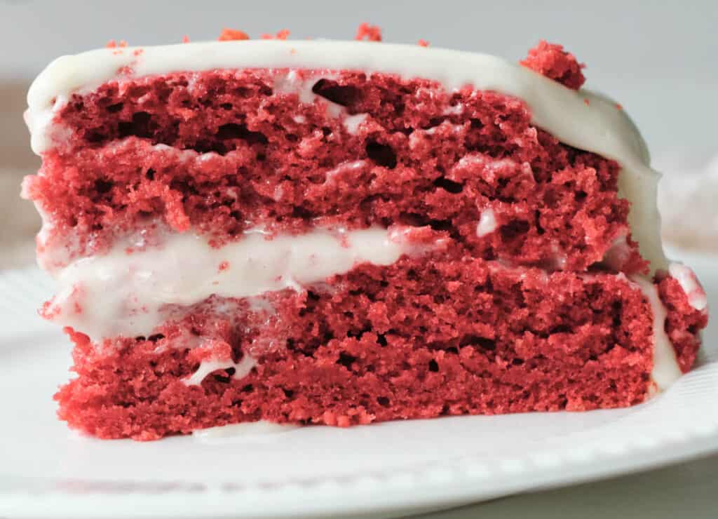 close up of red velvet cake on white plate
