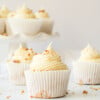 vegan carrot cake cupcakes with cream cheese frosting and chopped walnuts