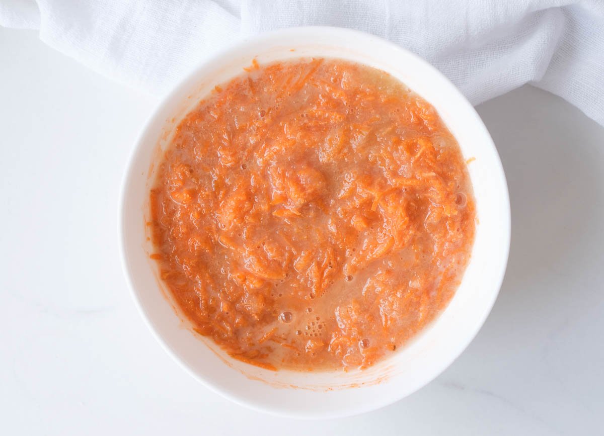 Wet ingredients with shredded carrots.