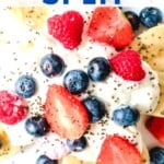 healthy banana split with blueberries, strawberries, and chia seeds